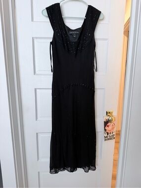 vintage Jones New York 100% silk black gown featuring a beaded scoop necklin